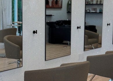 Modern salon chairs and mirrors at Blondes by lily in Englewood, Florida, US.