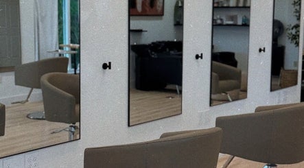 Modern salon chairs and mirrors at Blondes by lily in Englewood, Florida, US.