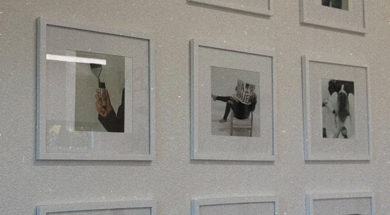 Gallery wall decor at Blondes by Lily, Englewood, Florida, US featuring framed creative posters.