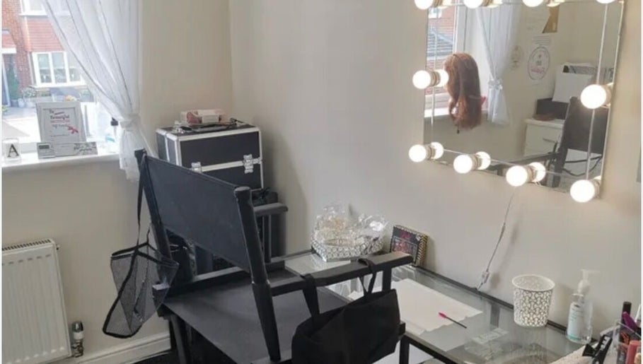 Vanity area with lights and chair at Tysbeautysalon in Bridgetown, Saint Michael, BB.