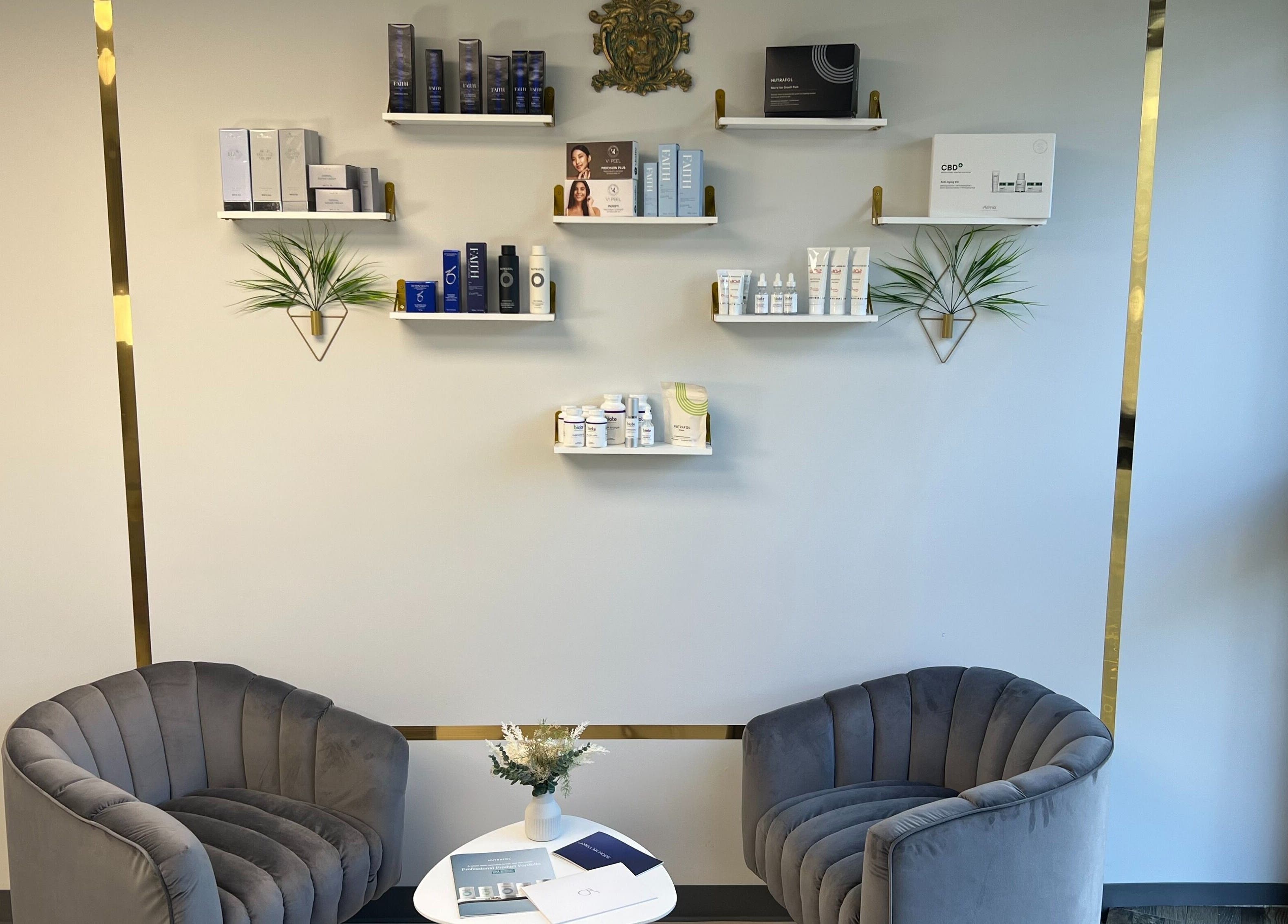 Elegant waiting area at Nova Vue Medical Spa Aesthetics in New York, New York, US with plush chairs and skincare products.