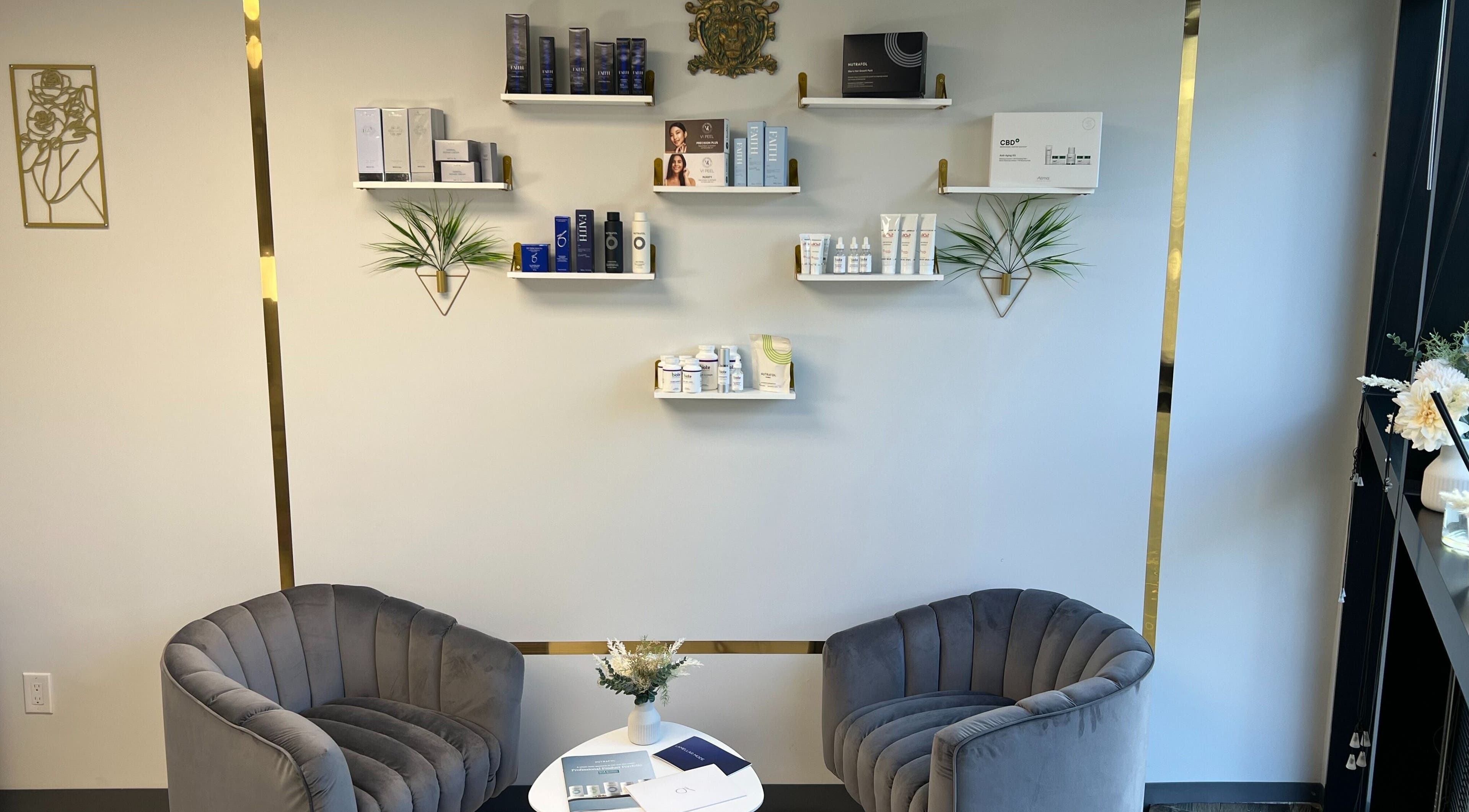 Elegant waiting area at Nova Vue Medical Spa Aesthetics in New York, New York, US with plush chairs and skincare products.