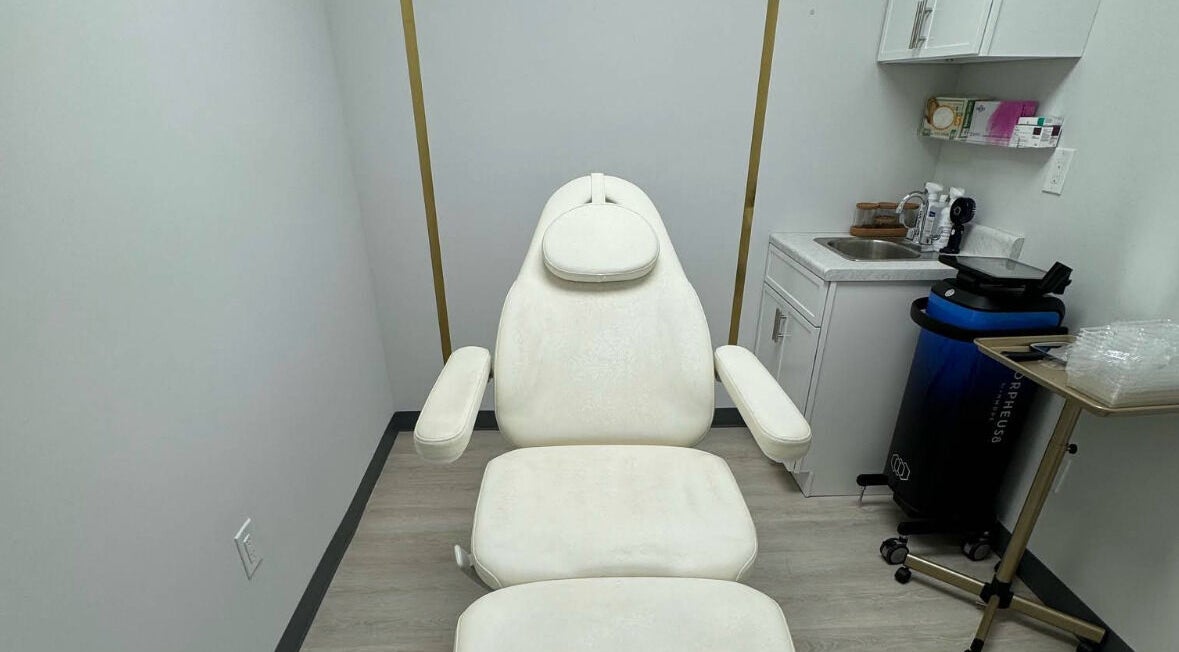 Relaxing treatment room at Nova Vue Aesthetics in New York, New York, US, featuring a plush white chair.
