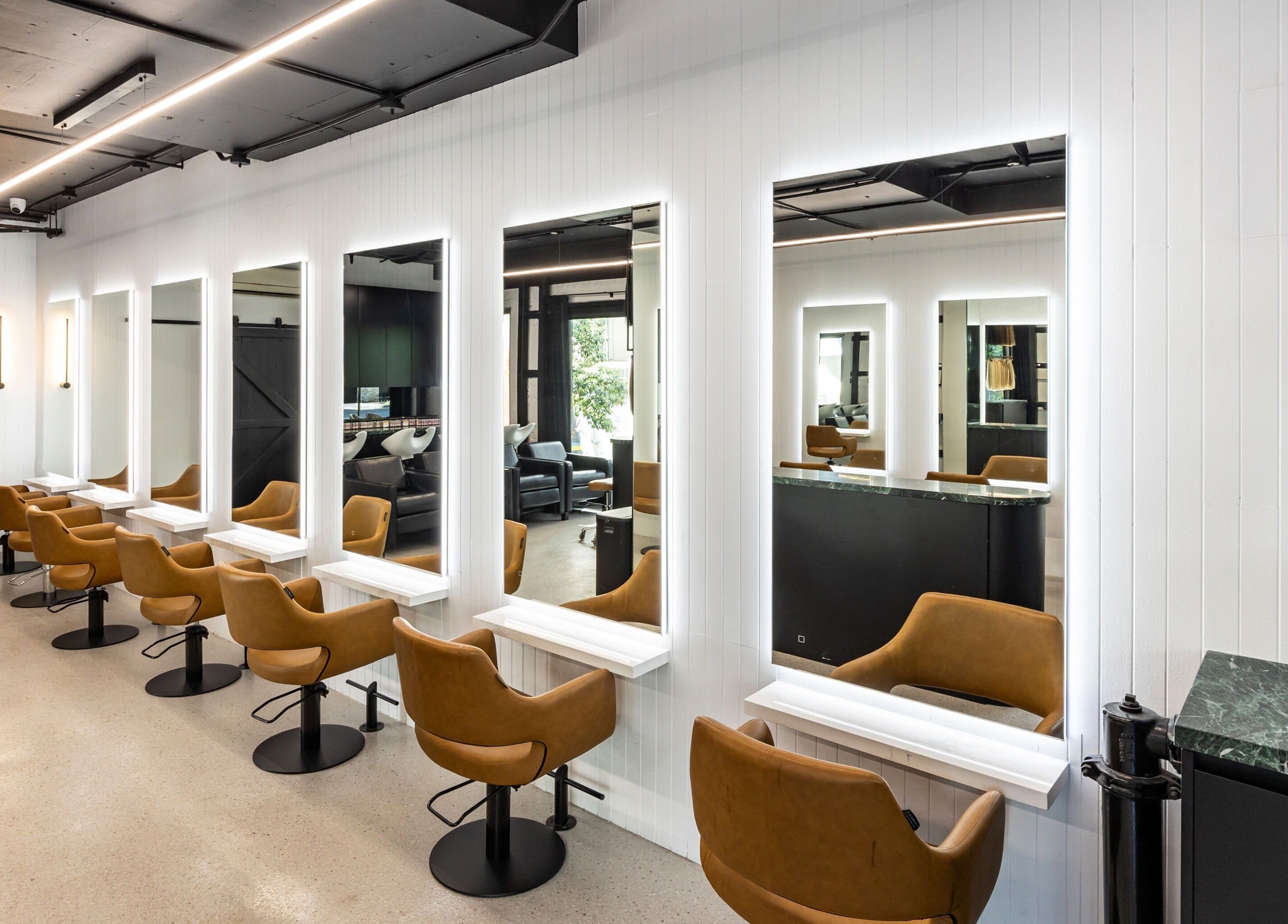 Elegant salon interior at MAISON MANE HAIR, Bondi Junction, New South Wales, AU with modern styling chairs.