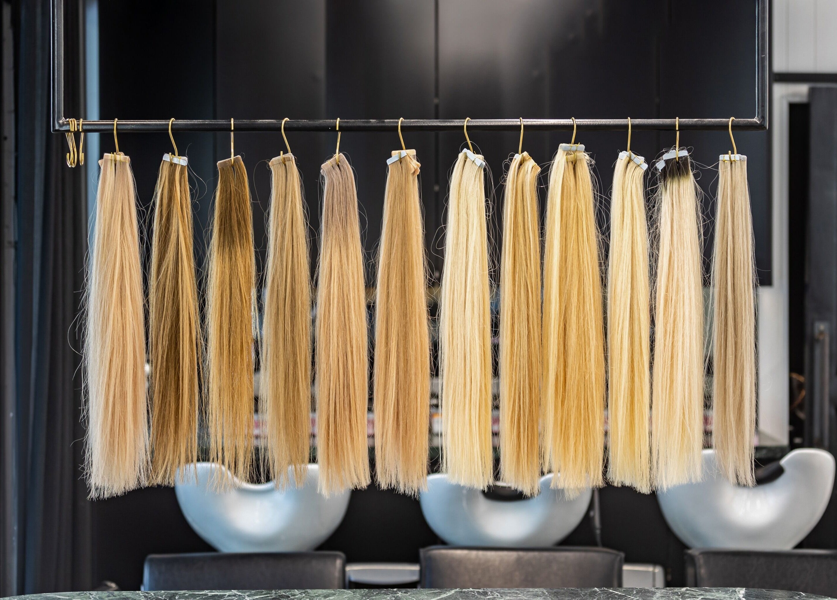 Hair extensions display at MAISON MANE HAIR, Bondi Junction, New South Wales, AU, showcasing a range of blonde shades.
