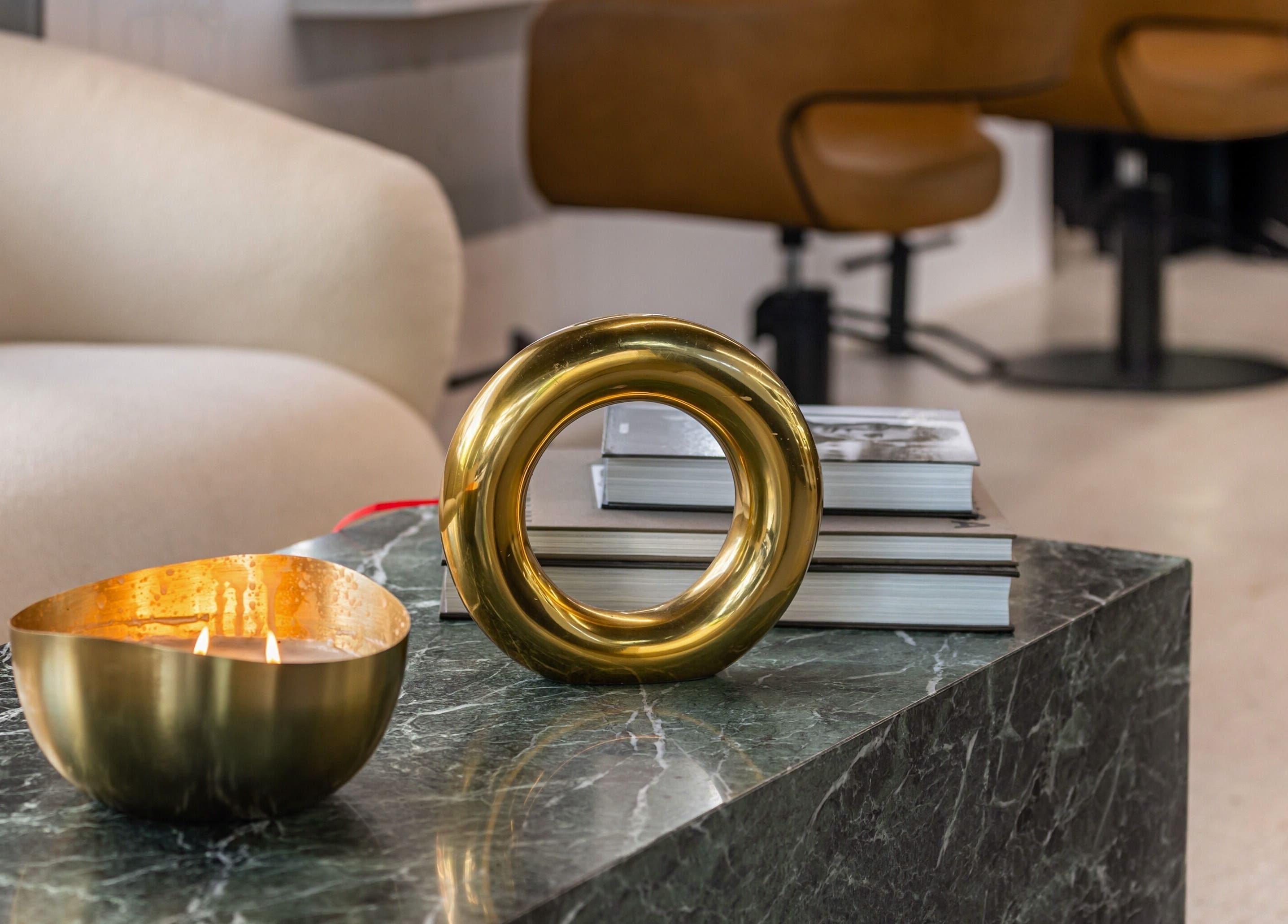 MAISON MANE HAIR cozy corner with modern decor enhances relaxation in Bondi Junction, New South Wales, AU.