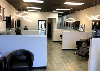 Modern interior of The Tattoo Lounge in Mesa, Arizona, US with stylish lighting and artwork on display.