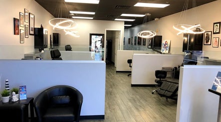 Modern interior of The Tattoo Lounge in Mesa, Arizona, US with stylish lighting and artwork on display.