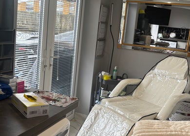 Relaxing treatment room at LSC Beauty & Aesthetics, Cardiff, Wales, GB, featuring a comfortable white chair.