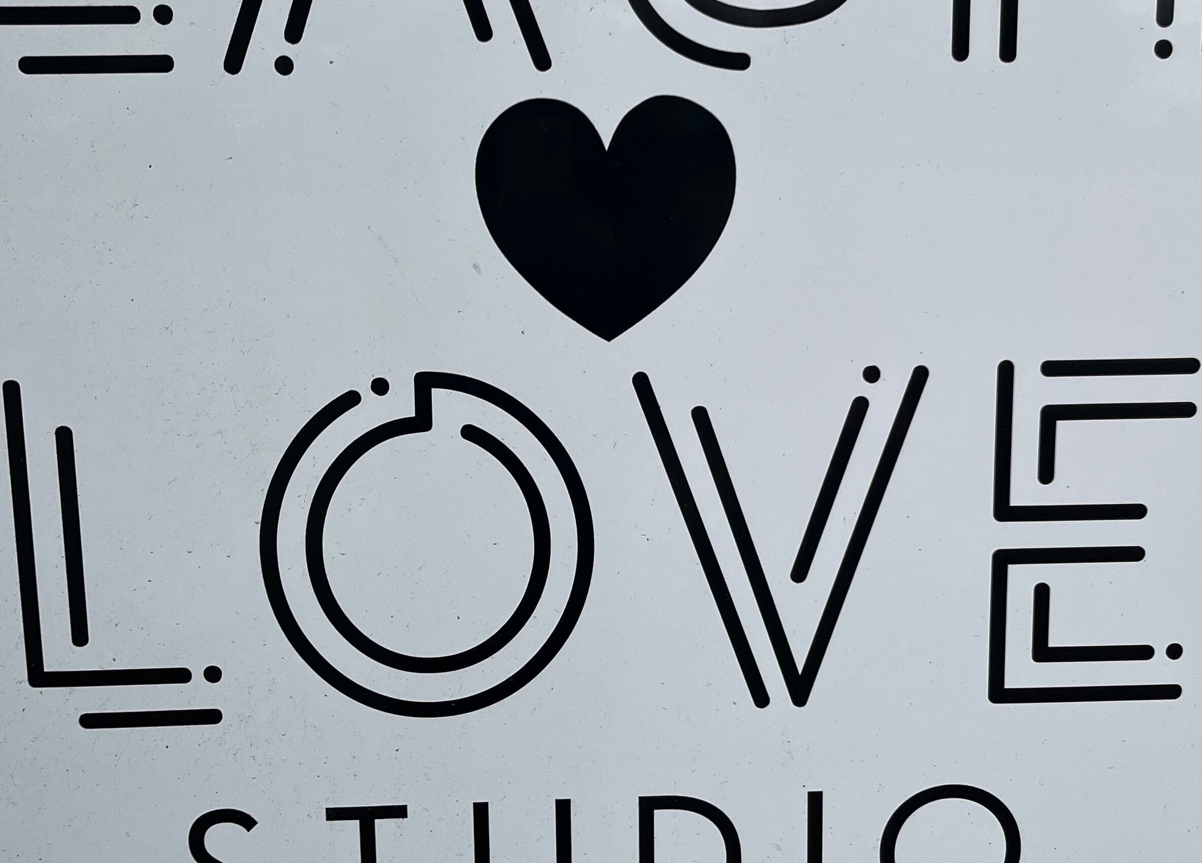 Bold 'LOVE' signage with heart at ByNataliemaria, Bromborough, England, GB.