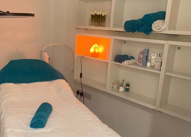 Treatment room at Chelsea Beauty in London, England, GB with a massage bed and soothing ambiance.