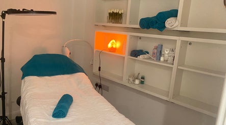 Treatment room at Chelsea Beauty in London, England, GB with a massage bed and soothing ambiance.