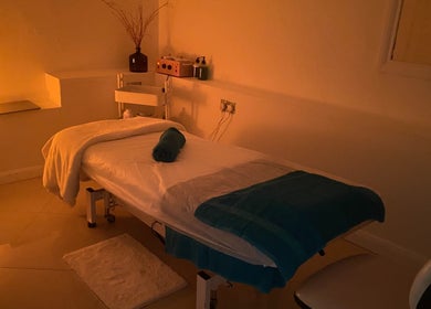 Massage room at Chelsea Beauty, London, England, GB with a lit, tranquil ambiance.