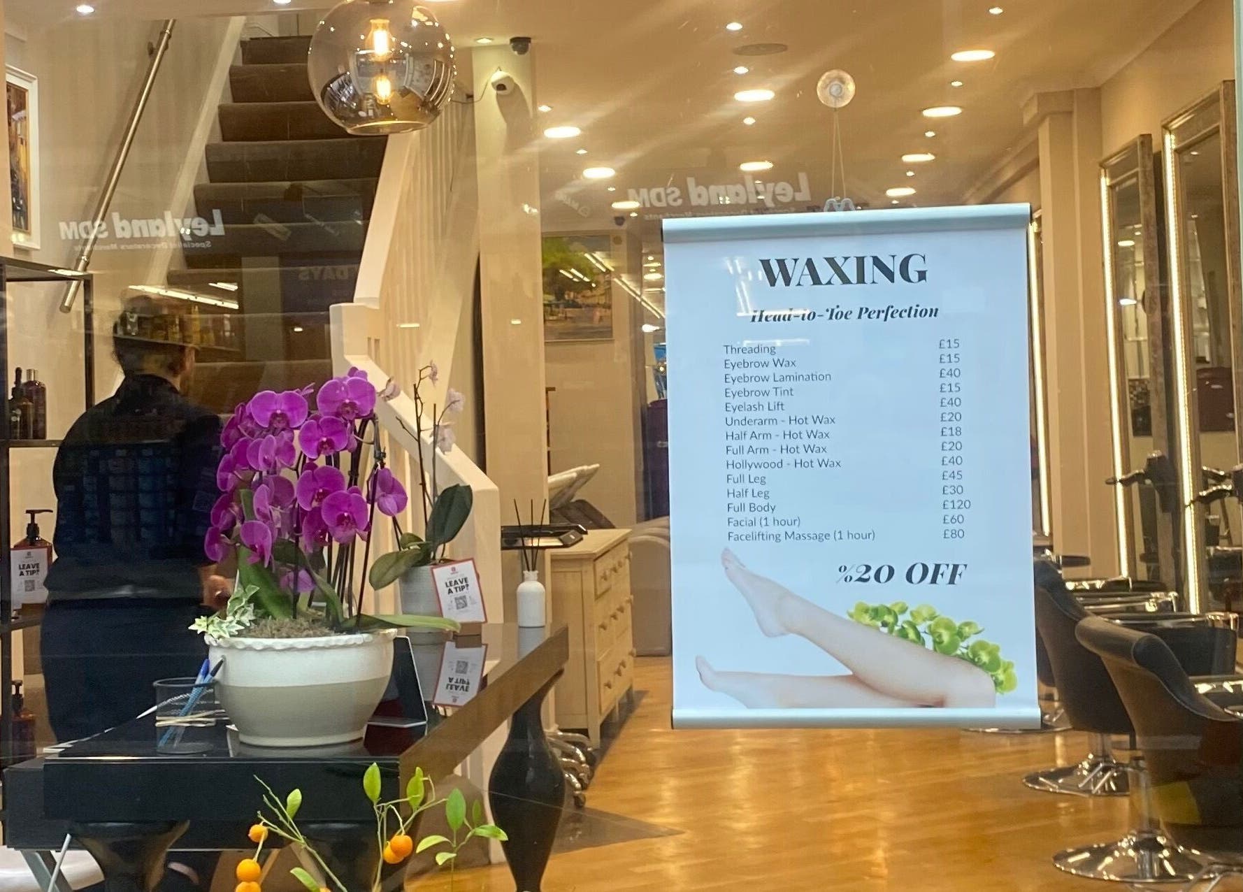 Interior of Aesthehealth Beauty & Medical Cosmetic, London, England, showcasing services and stylish decor.