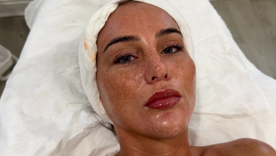 Relaxed individual enjoying a rejuvenating facial at Enhanced ByEl in Leeds, England, GB.