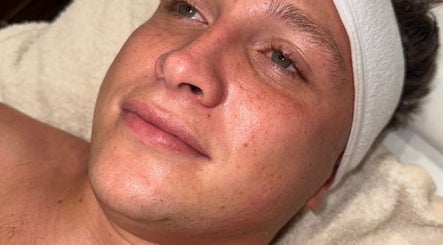 Relaxed face during facial treatment at Enhanced ByEl, Leeds, England, GB, showcasing smooth skin radiance.