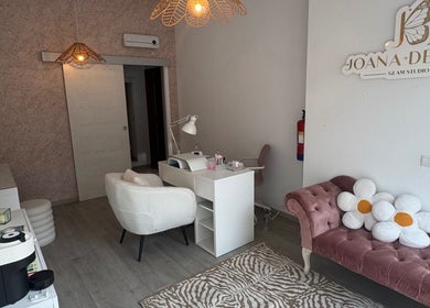 Joana Devesa Glam Studio in Condeixa-a-nova, Coimbra, PT features elegant decor and plush seating.