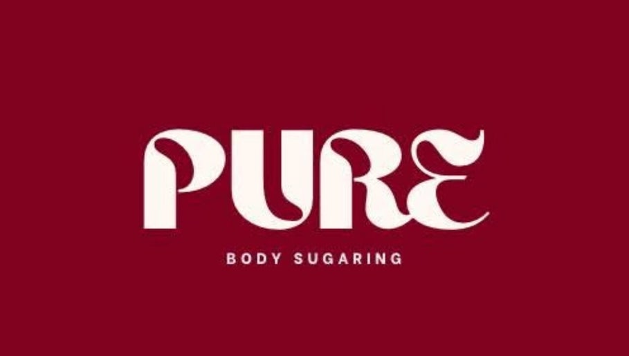 Pure Body Sugaring logo on a maroon background in Willemstad, Curaçao, CW.