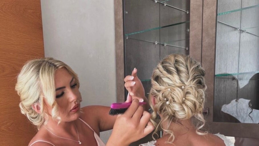 Stylist creating elegant updo at Larose Hair Studio, High Wycombe, England, GB.