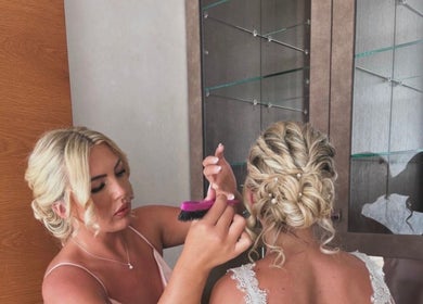 Stylist creating elegant updo at Larose Hair Studio, High Wycombe, England, GB.