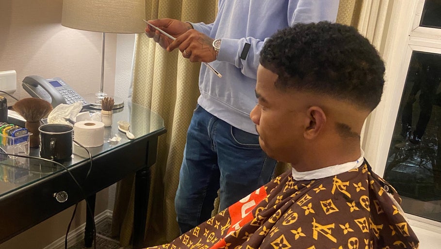 Client receiving a stylish haircut at Massie’s Barber Shop, Stellenbosch, Western Cape, ZA.