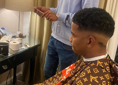 Client receiving a stylish haircut at Massie’s Barber Shop, Stellenbosch, Western Cape, ZA.