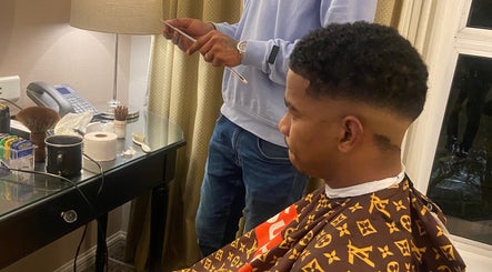 Client receiving a stylish haircut at Massie’s Barber Shop, Stellenbosch, Western Cape, ZA.