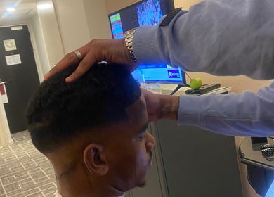 Stylist perfects a fade at Massie’s Barber Shop, Stellenbosch, Western Cape, ZA.