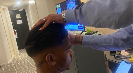 Stylist perfects a fade at Massie’s Barber Shop, Stellenbosch, Western Cape, ZA.