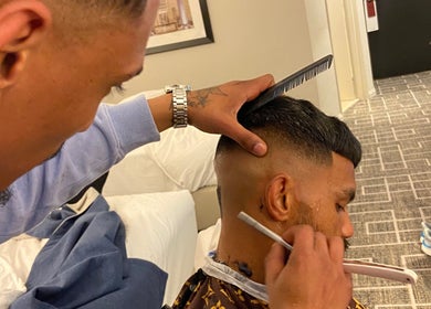 Barber crafting a sharp fade at Massie’s Barber Shop, Stellenbosch, Western Cape, ZA.
