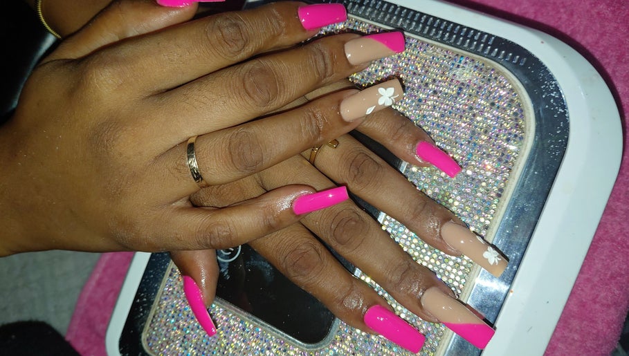 Stylish pink and nude nail art with floral design by Nailedbylee, Junction, St. Elizabeth Parish, JM.