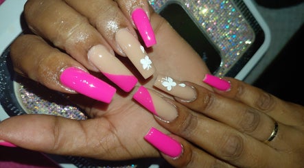 Elegant pink and nude nails with floral design at Nailedbylee, Junction, St. Elizabeth Parish, JM.