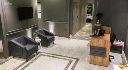 Modern lobby at Let's Relax Royal Galata Spa & Turkish Bath, İstanbul with cozy seating and reception desk.