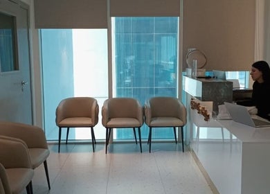 Reception area of Meta Poly Clinic in دبي, دبي, AE featuring cozy seating and modern decor.