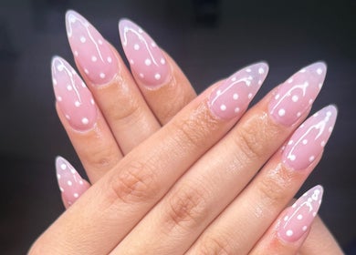 Elegant pink and white polka dot nails by ND Nails in Melbourne, Victoria, AU, showcasing expert nail artistry.