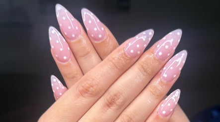 Elegant pink and white polka dot nails by ND Nails in Melbourne, Victoria, AU, showcasing expert nail artistry.