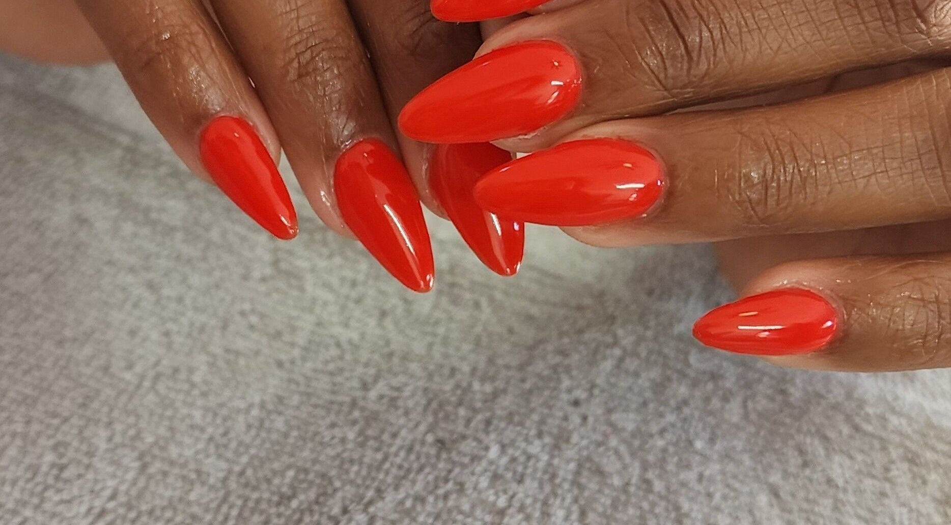 Vibrant red manicure at Holistic Sculpt & Beauty, Kempton Park, Gauteng, ZA.