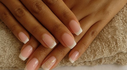 Classic French manicure from Tips & Nails by Lee in Cape Town, ZA. Perfectly polished nails on a soft towel.
