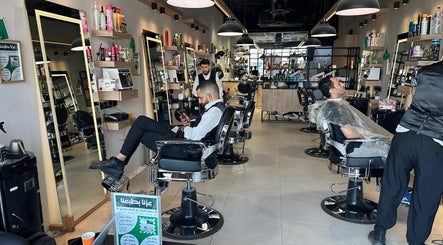 Modern barbershop setup at Wakar Al Chaib, Riyadh, Riyadh Province, SA, featuring stylish seating and grooming tools.