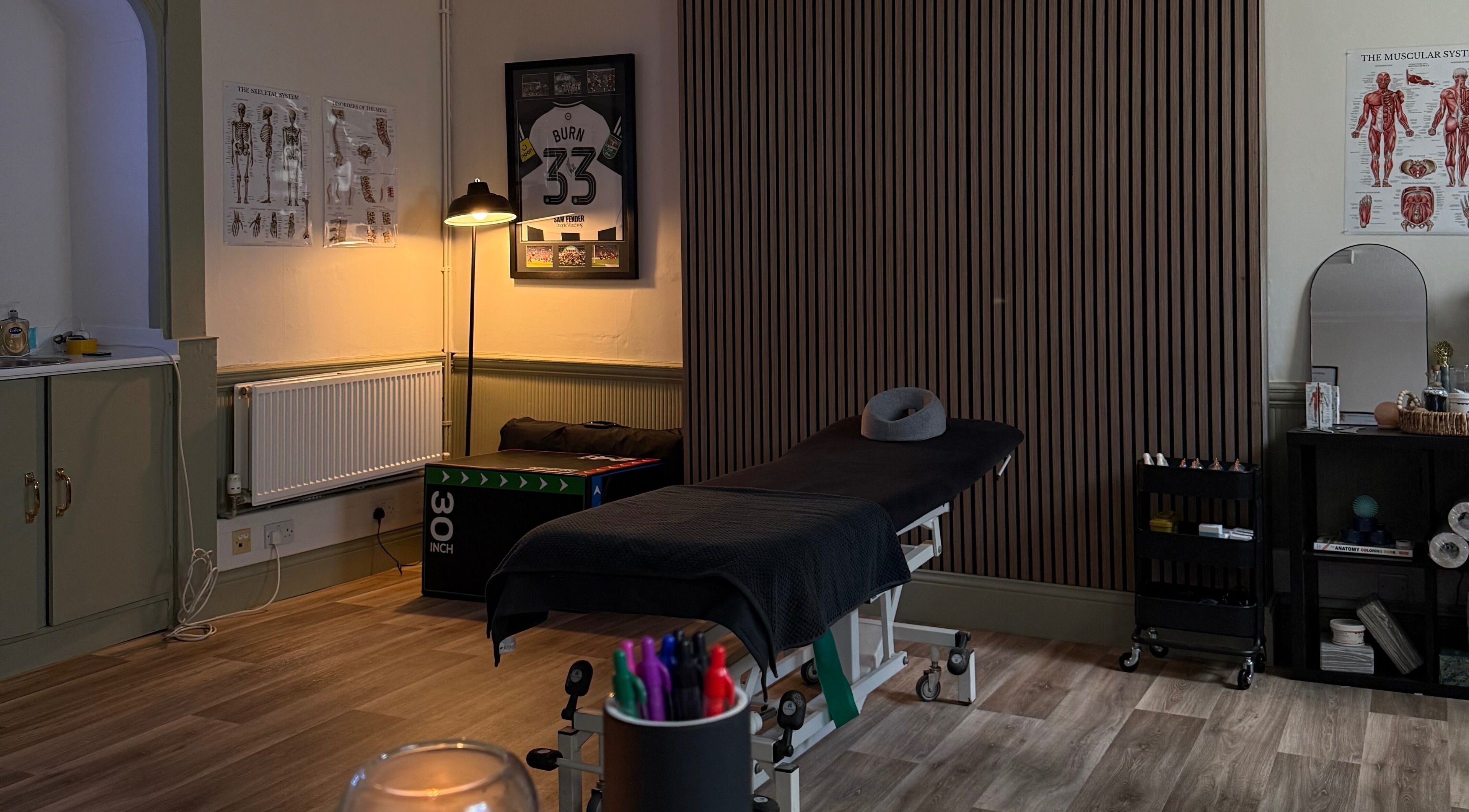 Relaxing therapy room at MD Sport & Exercise Therapy, Berwick-upon-tweed, England, GB, featuring massage table.