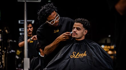 Barber perfecting a hairstyle at Sleek Care, Riyadh, Riyadh Province, SA for a stylish look.