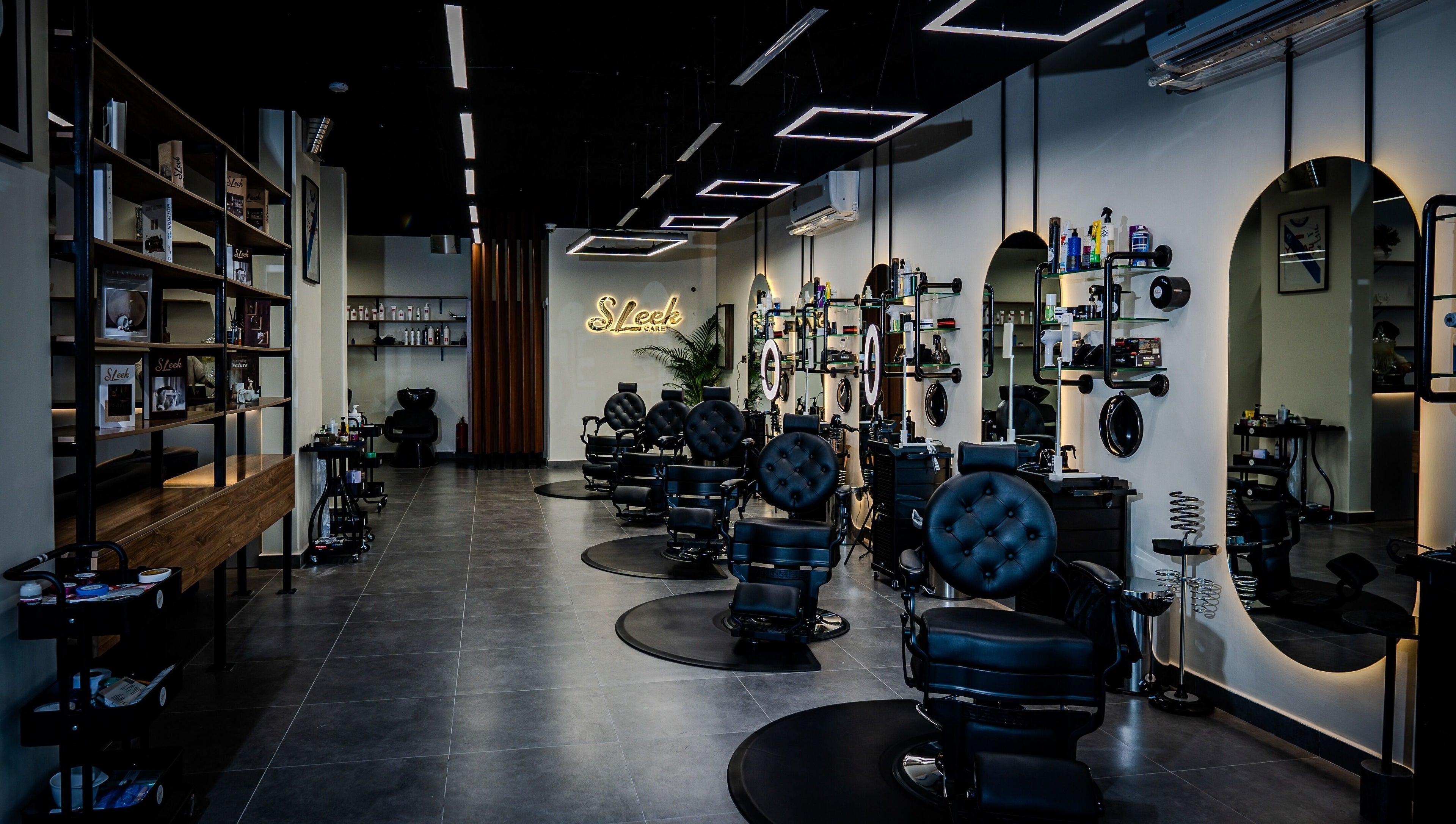 Modern salon interior at Sleek Care in Riyadh, Riyadh Province, SA featuring stylish decor and comfy chairs.