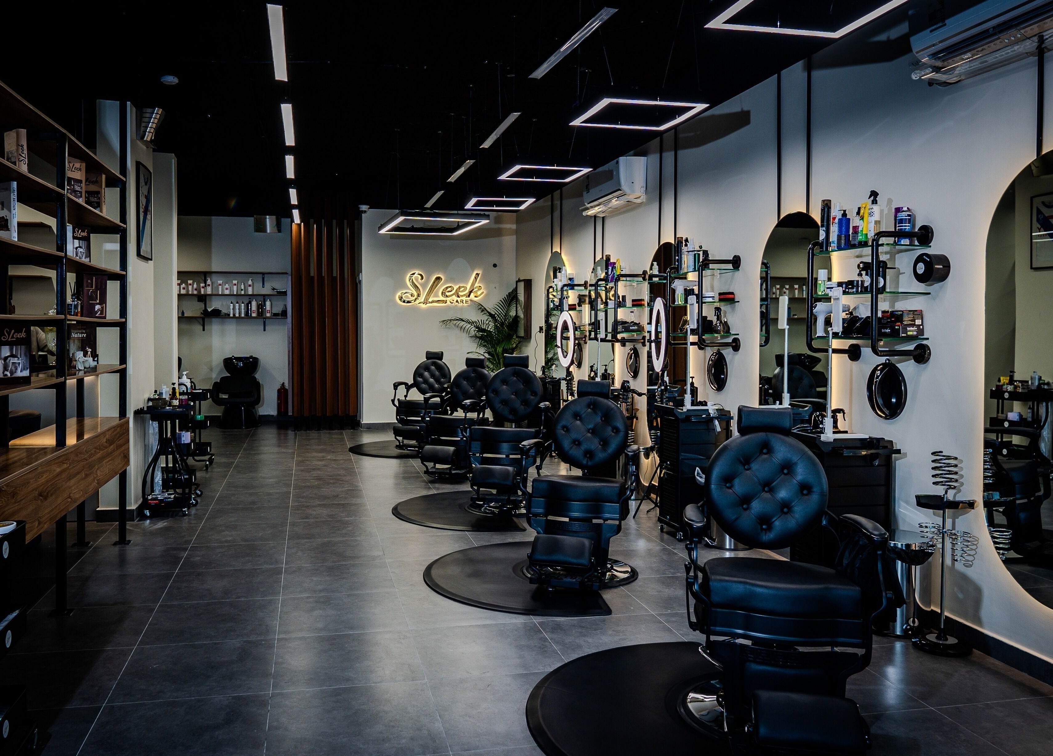 Modern salon interior at Sleek Care in Riyadh, Riyadh Province, SA featuring stylish decor and comfy chairs.
