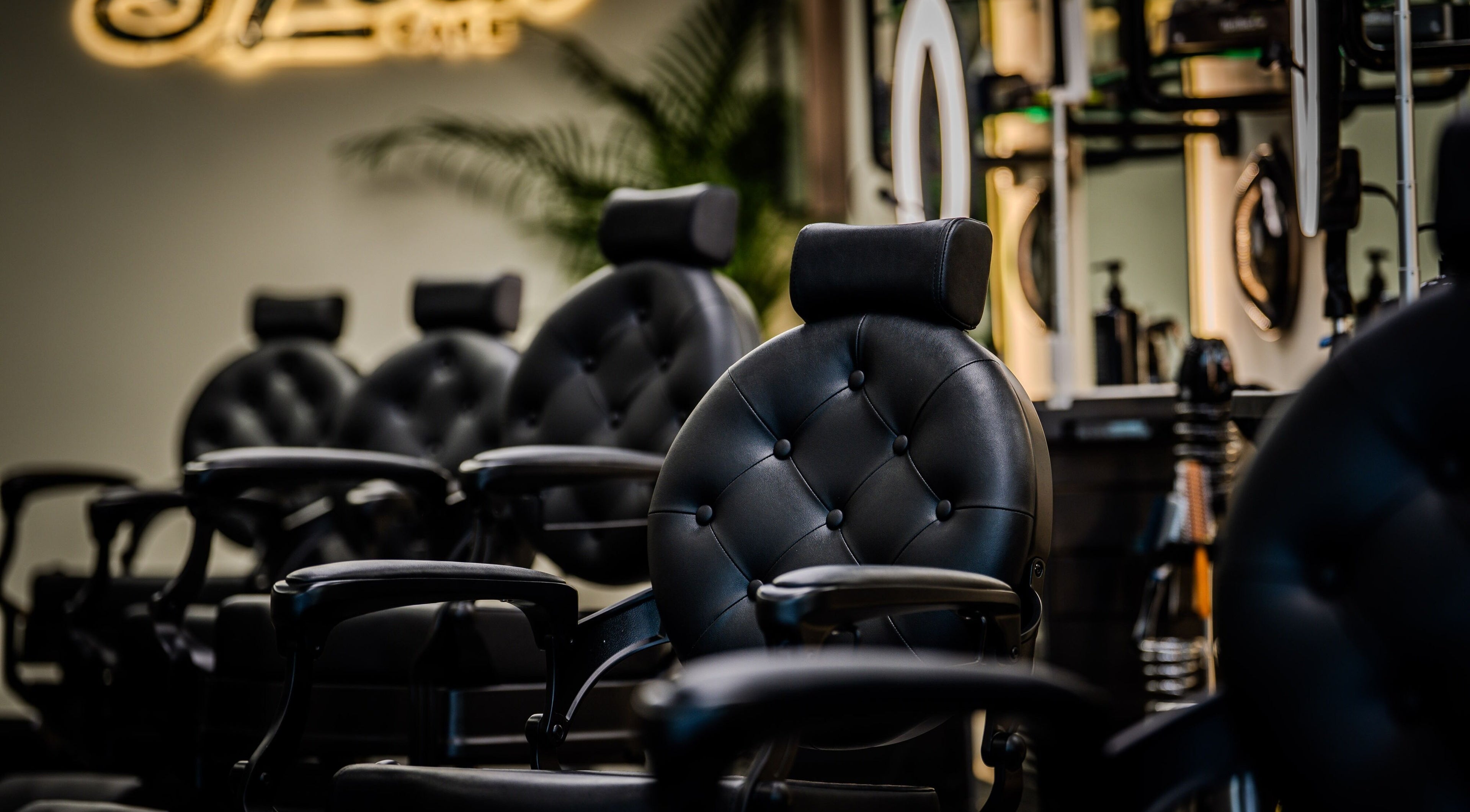 Elegant black salon chairs at Sleek Care, Riyadh, Riyadh Province, SA offering premium beauty services.