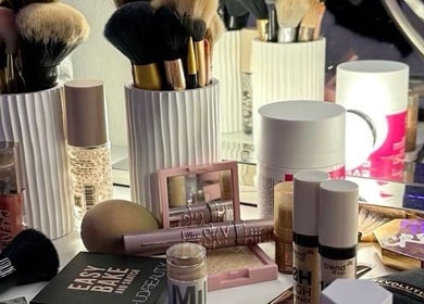 Beauty products at Beaute by Romi, Leeds, England, GB; makeup brushes and cosmetics showcased elegantly.
