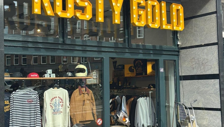 Exterior of The Wolf Barber Shop, Amsterdam, Noord-Holland, NL, showcasing stylish apparel and accessories.