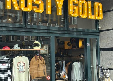 Exterior of The Wolf Barber Shop, Amsterdam, Noord-Holland, NL, showcasing stylish apparel and accessories.
