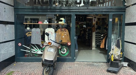 The Wolf Barber Shop exterior showcasing retro style in Amsterdam, Noord-Holland, NL.