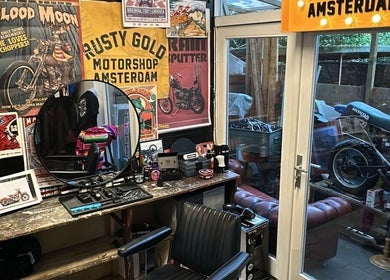 Eclectic barber station with vintage decor at The Wolf Barber Shop, Amsterdam, Noord-Holland, NL.