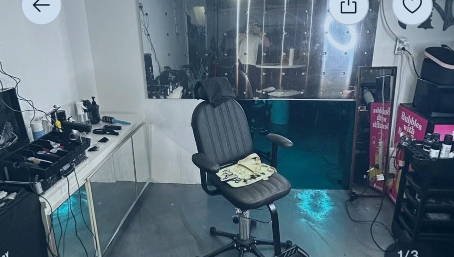 Modern barber chair at Payso Cuts, New York, New York, US, surrounded by stylish salon tools.